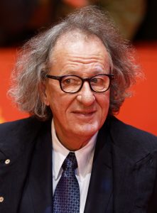 Geoffrey Rush som Lionel Logue