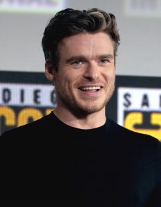 Richard Madden som John Reid